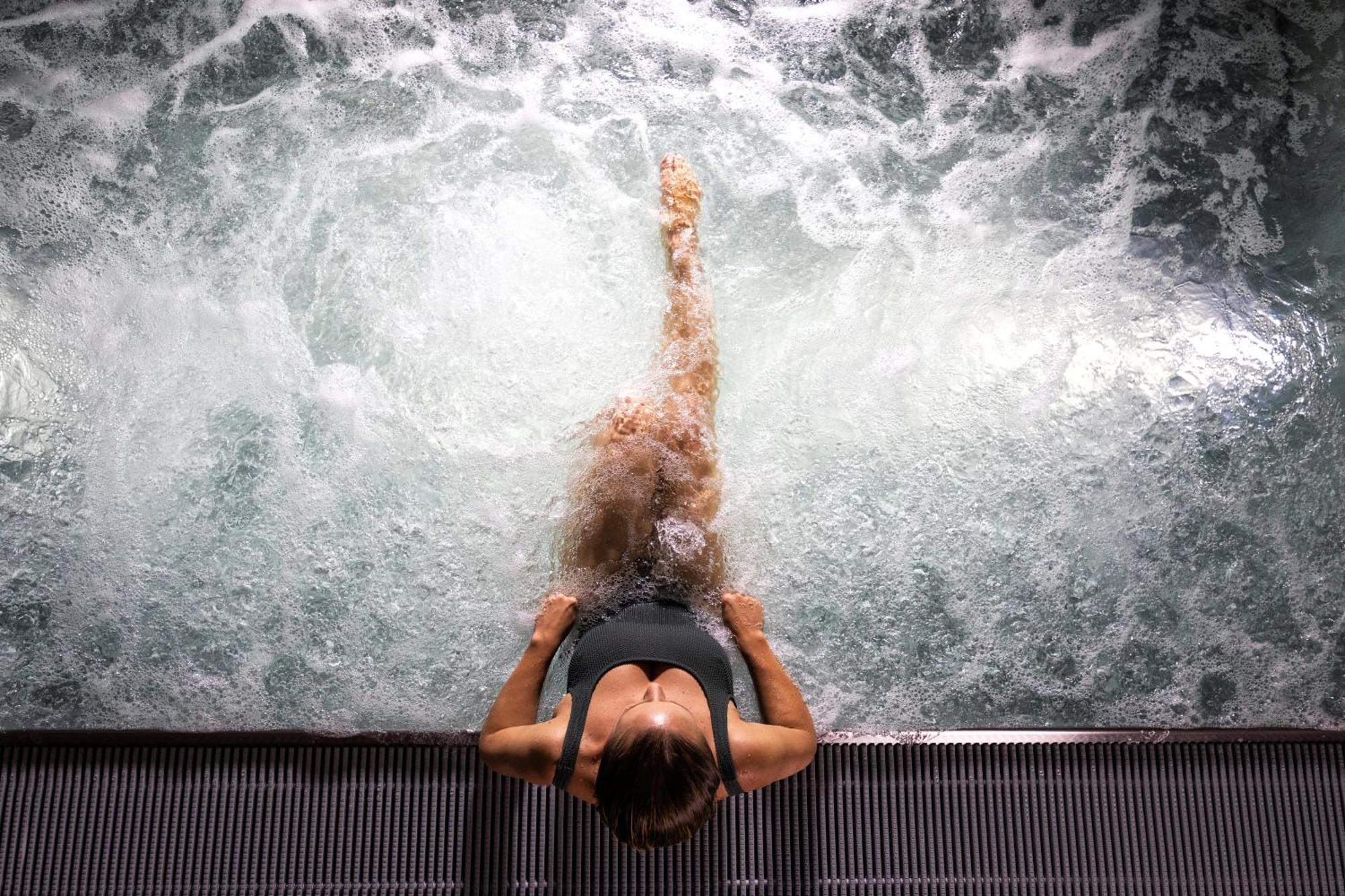 Hilton Rijeka Costabella Beach Resort And Spa Exterior photo A woman in a whirlpool