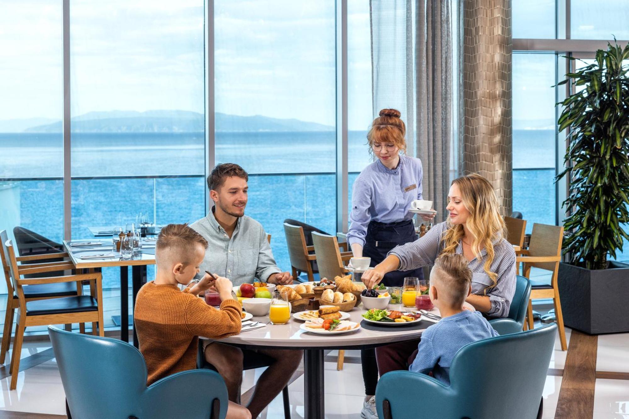 Hilton Rijeka Costabella Beach Resort And Spa Exterior photo Family dining at the airport