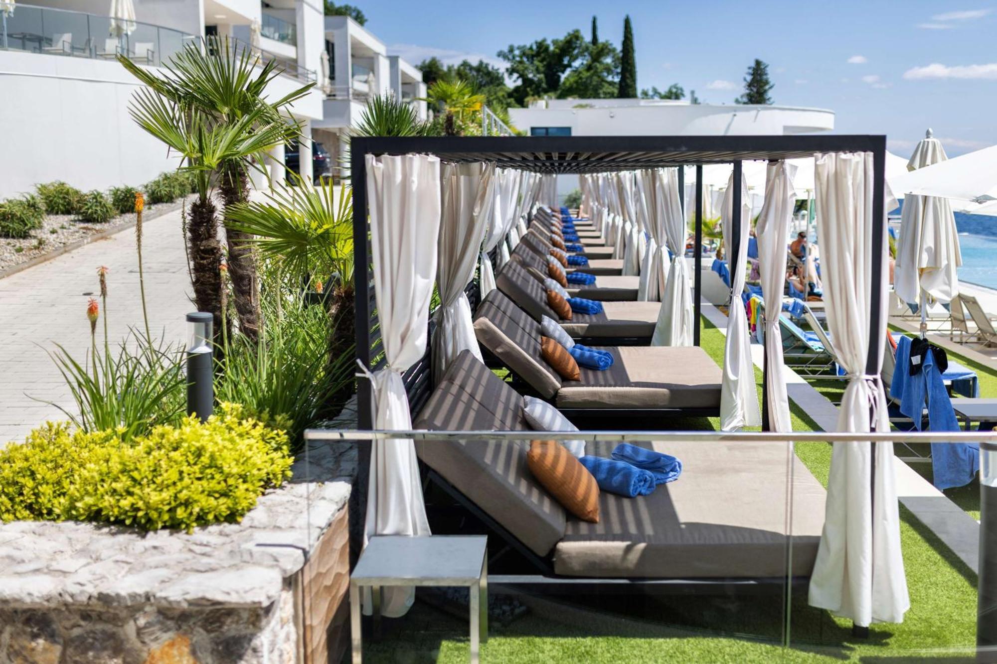 Hilton Rijeka Costabella Beach Resort And Spa Exterior photo Cabana at a resort